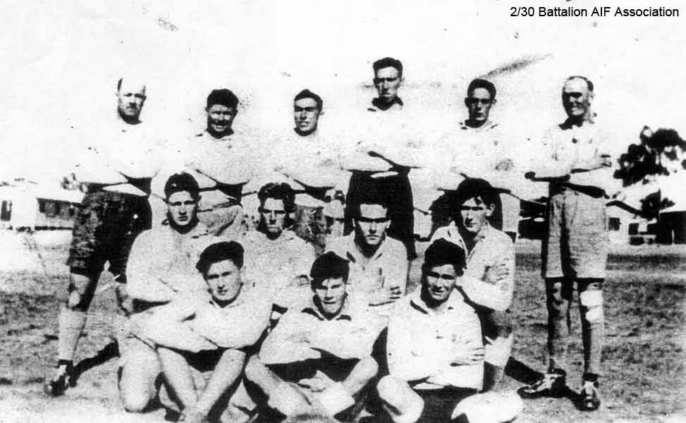 A Company Football Team
Left to right:

Back row:
1) NX70486 - BOOTH, Edward Holroyd (Baldy), Capt. - D Company, O/C
2) NX34443 - EVANS, Garrett William (Garry), L/Cpl. - A Company, 8 Platoon 
3) NX51454 - ABRAHAMS, Harry Stirling (Harry), Cpl. - A Company, 7 Platoon
4) NX54846 - ARNEIL, Stanley Foch (Horse), Sgt. - A Company, 7 and 8 Platoon
5) NX56869 - BLANSHARD, Douglas Copeland (Doug), Sgt. - A Company, 8 Platoon 
6) NX47953 - WILLIAMS, Frank Edward (Ned), Pte. - A Company, 8 Platoon

Middle Row:
1) NX47952 - VEIVERS, Charles Thomas (Joe), Pte. - A Company, 9 Platoon
2) NX33290 - CHAPMAN, Keith Milford (Chappie), Pte. - A Company, 8 Platoon
3) NX4416 (NX16609) - SWAIN (Swanson), Victor Leonard, Pte. - A Company
4) NX25458 - WATT, Edward Louvain (Ted), Cpl. - A Company, 9A Platoon 

Front row:
1) NX4417 - PEARCE (Pearson), Bruce Donald (Donald Bruce) (Joe), Pte. - A Company, 8 Platoon 
2) NX54534 - ASGILL, Colin Cyril (Matey), Pte. - A Company, 8 Platoon
3) ? - SWAIN, K. T. 

