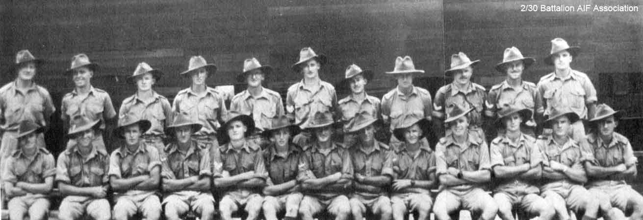 C Company NCOs and CSM
C Company NCOs and CSM at Batu Pahat on 23/10/1941.

Left to right:

Back row (standing):
1) NX53537 - CLYNE, Edward Francis (Ted or Tunnel), S/Sgt. - C Company, CQMS
2) NX26495 - McMAHON, Bernard Stanislaus (Stonja or Bernie), Sgt. - C Company, 14 Platoon
3) NX46619 - KORSCH, John Donald, Cpl. - C Company, 14 Platoon
4) NX41134 - EATHER, Walter Barnett (Wal), Sgt. - C Company, 15 Platoon
5) NX27012 - SCHOFIELD, Phillip Alfred (Schoey or Phil), WO2 - C Company, CSM
6) NX66981 - DENGATE, Edgar Norman, Lt. - B Company, O/C 12 Platoon
7) NX2538 - JOHNSTON, Ronald Athol (Ron), Cpl. - C Company, 14 Platoon
8) NX55473 - O'DONNELL, Colin Squire (Col), Sgt. - C Company, 15 Platoon
9) NX47748 - JOHNSON, George Edward Thomas (Big Johnno), A/U/Sgt. - C Company, 15A Platoon
10) NX38682 - McDOUGALL, Eldred Ernest (Jock), A/U/Sgt. - C Company, 15A Platoon
11) NX37575 - MITCHELL, Bruce, Cpl. - C Company, 13 Platoon

Front row (sitting):
1) NX32334 - SURTEES, Robert Edward James (Bob), L/Sgt. - C Company, Ord. Room
2) NX26185 - BUTT, Frederick George (Fred), A/Sgt. - C Company, 15 Platoon
3) NX47004 - ROCKETT, Thomas, Cpl. (Tom) - C Company, 15 Platoon
4) NX36493 - HANNA, Rupert Clyde, Cpl. - C Company, 15 Platoon
5) NX29283 - JENNINGS, Edward Henry (Ted), Sgt. - C Company, 15 Platoon
6) NX54468 - ENNIS, William (Bill), A/Sgt. - C Company, 15 Platoon
7) NX47456 - ROWE, Aubrey Nelson (Jack), A/Cpl. - C Company, 15A Platoon
8) NX47453 - THOMPSON (Eugarde), Frederick George (Percival) (Percy), Cpl. - C Company, 13 Platoon
9) NX47295 - EAREA, Harry James Manning, L/Cpl. - C Company, 13 Platoon
10) NX37498 - JACK, Robert William (Bob), Sgt. - C Company, 13 Platoon
11) NX47209 - KENNEDY, Thomas Joseph Frederick (Tom), A/U/Sgt. - C Company, 14 Platoon
12) NX47292 - OSMOND, George Alwyn, A/Cpl. - C Company, 14 Platoon
13) NX47351 - DARE, Thomas Lionel (Tom), A/Cpl. - C Company, 13 Platoon 
