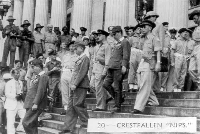 020 - Crestfallen "Nips"
Senior Japanese officers being escorted from the Municipal Buildings in Singapore, following the signing of the surrender terms.
