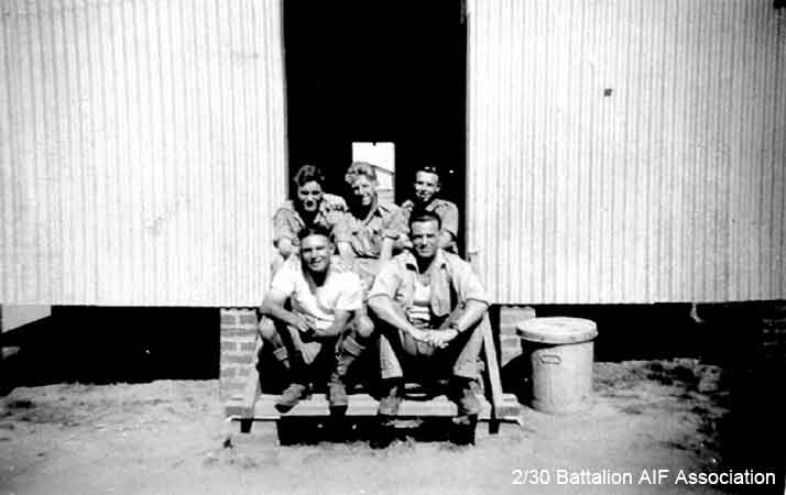 Bathurst Army Camp
On the steps of the A Company hut at Bathurst, 1941.

Left to right:
Back row:
1) NX31041 - BUTLER, Bernard Charles (Barney), Pte. - A Company,  9 Platoon, transferred to 8 Training Bn. on 22/5/1941
2) NX27550 - WILSON, David Royce (Doc), A/Cpl. - A Company,  9 Platoon
3) NX20492 - HART, Sidney Kirkwood (Sid), Pte. - A Company,  9 Platoon, WiA Gemas

Front row:
1) NX25485 - GAGE, Frederick Clifton (Fred), Pte. - A Company,  9 Platoon, discharged 7/7/1941
2) NX33886 - CROFT, George Alexander, A/U/Sgt. - A Company,  9 Platoon, WiA Tyersall Palace, to AAOC Changi; Bn. Bootmaker
