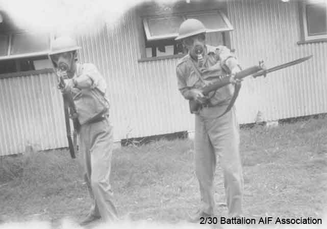 Training in Bathurst
Practicing for a gas attack, at Bathurst in 1941.

Indetified in this photo are:

NX30914 - BROWN, Gordon Victor (Doover), Lt. - A Company, O/C 7 Platoon
