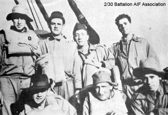 On the Johan
"Wal Eather and some of "C" Company on the 'Johan'.  Life boat drill on the Johan Van Oldenbarnevelt (HMT FF)."

Left to right:

Back row:
1) NX41134 - EATHER, Walter Barnett (Wal), Sgt. - C Company, 15 Platoon
2) NX37294 - FORWARD, Kenneth (Frank Walter Leslie) (Ken), Pte. - C Company, 13 Platoon
3) NX37305 - KENTWELL, Ronald (Popeye), Pte. - C Company, 13 Platoon
4) NX37296 - JONES, Ashley Chave, Pte. - C Company, 13 Platoon

Front row (partly obscured):
1) NX36377 - RANDLE, Francis George Edward (Frank), Pte. - C Company, 15 Platoon
2) NX55568 - CONEN, Sidney Graham (Sid), Pte. - C Company, 14 Platoon
3) NX46920 - HEDWARDS, Cornelius Michael (Con), Pte. - C Company, 14 Platoon
Keywords: Makan264
