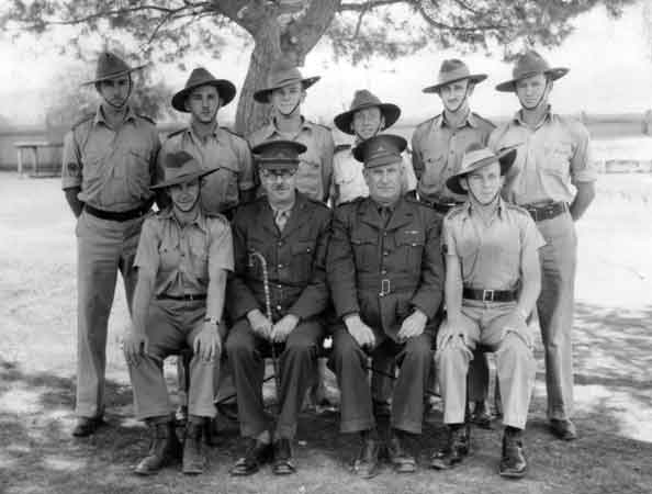 Tamworth
Group of soldiers from an unknown Unit, at Tamworth. The back of the photo shows the maker of the photograph as G.A. SOLOMONS of 245 Peel Street, Tamworth.

Left to right:

Back row:
1)
2)
3)
4)
5)
6)

Front row:
1)
2)
3)
4) NX68127 - SMYTH, Frank Miles (Wakey Wakey), Lt. - A Company, CSM
Keywords: 070121