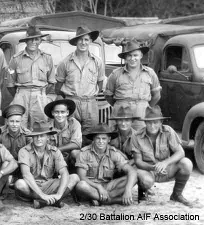 Transport Platoon - part 4
Transport Platoon in Malaya (probably at Batu Pahat)
 
Left to right:

Back row (standing):
1) NX32743 - TOME, Frank, Sgt. - HQ Company, Transport Platoon
2) NX2560 - HALES, Leslie John (Lofty), Pte. - HQ Company, Transport Platoon
3) NX47566 - PEARCE, Thomas Francis (Tom), Pte. - HQ Company, Transport Platoon

Middle row (kneeling):
1) NX46067 - CRUMMY, Stanley Arthur Kevin (Nugget), Pte. - HQ Company, Transport Platoon
2) NX50687 - HARDMAN, John Kethel (Curly), Pte. - HQ Company, Transport Platoon
3) NX45759 - FLANAGAN, Francis William (Frank), L/Cpl. - HQ Company, Transport Platoon
4) NX2543 - PARKES, Ernest Thomas (Ernie), Pte. - HQ Company, Transport Platoon

Front row (sitting cross legged):
1) NX67413 - COLLINS, John Cyril (Jack), Pte. - HQ Company, Transport Platoon
2) NX60651 - APPS, Thomas (Tom), Pte. - HQ Company, Transport Platoon
Keywords: Makan332 070121