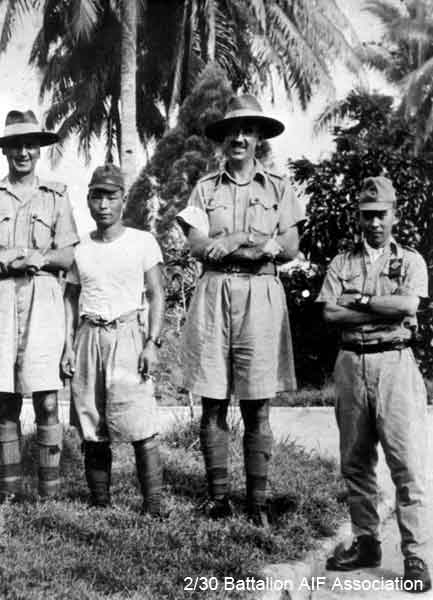 X1 Tunneling Party, Johore
Officers and Japanese guards attached to X1 Tunneling Party in Johore in 1945.

Left to right (standing):

1) NX70416 - GALLEGHAN (Sir), Frederick Gallagher (Black Jack), Brig. - BHQ. CO. 2/30 Bn.
2)
3) NX34792 - DUFFY, Desmond Jack (Mum or Des), Capt. - O/C B Company
4)
Keywords: 070506