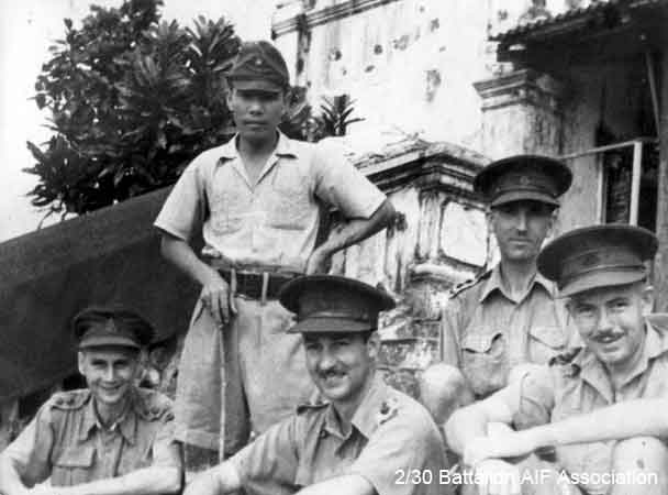 X1 Tunneling Party, Johore
Officers and Japanese guards attached to X1 Tunneling Party in Johore in 1945.

Left to right:

1)
2)
3) NX34792 - DUFFY, Desmond Jack (Mum or Des), Capt. - O/C B Company
4)
5)


Keywords: 070506