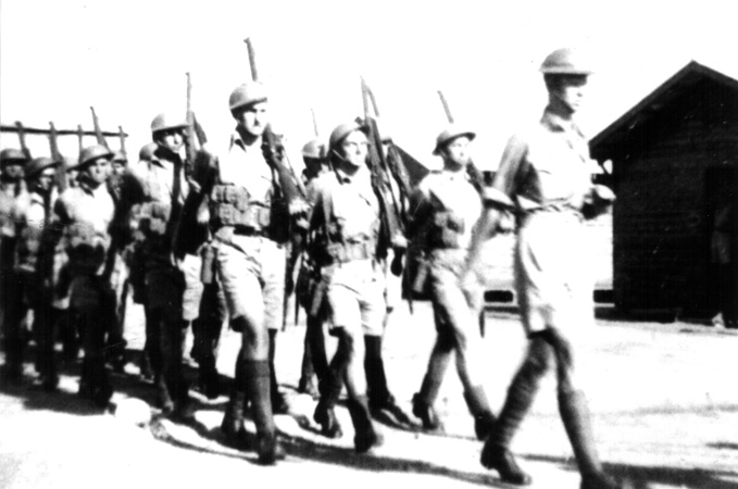 D Company, 17 Platoon
In training, possibly at Bathurst.

Leading the march:
1) NX70451 - DONOHOE, Kevin Gordon Cyril, Lt. - D Company, O/C 17 Platoon 

Section Leaders - left to right:
1) NX51730 - ISAAC, Arthur William John (Ike), A/U/L/Sgt. - D Company, 17 Platoon, 6 Section
2) NX32458 - ALEXANDER, Maxwell Arnold (Max), Cpl. - D Company, 17 Platoon, 5 Section
3) NX32703 - MOYNIHAN, William James (Bill ), Sgt. - D Company, 17 Platoon, 4 Section

Keywords: 090811a