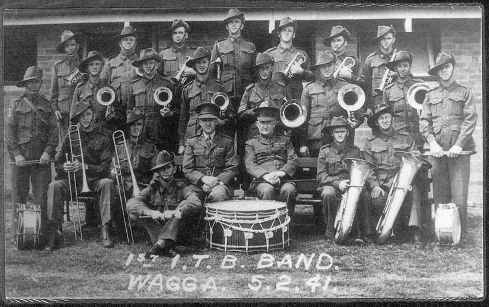 1st ITB Band
1st Infantry Training Battalion Band at Wagga Wagga on 5/2/1941, fifteen of whom later served with the 2/30th.

Left to right:

Back row:
1) NX68235 - COPLEY, Francis Peter (Frank), Pte. - BHQ, Band
2) ? - BLACK, E.
3) NX36270 - ELPHICK, James Jack (Jack), Pte. - BHQ, Band
4) NX36443 - RINGWOOD, Stanley (Stan), Sgt. - BHQ, Band
5) NX36324 - BROUFF, Charles William (Charlie), Pte. - BHQ, Band
6) NX68237 - HODGE, William Peter (Bill), Pte. - BHQ, Band
7) NX68236 - LUGTON, Stanley James (Stan), Cpl. - BHQ, Band

Middle row:
1) ? - FRENCH, M.
2) ? - SEABROOK-BIGGS, A.
3) NX36267 - WHITTERON, Edward Sprowell (Eddie), Pte. - BHQ, Band
4) ? - HOMANN, Sgt. (Band Master)
5) NX68232 - TEMPLEMAN, John James (Ben), Pte. - BHQ, Band
6) ? - PARSONS, A.

Front row:
1) NX68238 - DESMET, Stanley Job (Bill or Stan), Pte. - BHQ, Band
2) NX35482 - MOUNTFORD, Lawrence Gordon (Laurie), L/Cpl. - BHQ, Band
3) ? - JOHNSON, Capt.
4) ? - FORD, Colonel, (C.O.)
5) ? - CARTHEW, E.
6) NX36839 - EDMONDSTONE, Bertie Joseph (Bert), Pte. - BHQ, Band

Standing to left side:
1) NX36098 - HART, James (Shorty or Jim), Pte. - BHQ, Band

Standing to right side:
1) NX36719 - MONTGOMERY, James William (Monty or Jim), Pte. - BHQ, Band

Front seated:
1) NX36271 - GOUGH, William George (George), Pte. - BHQ, Band 
Keywords: 100216a
