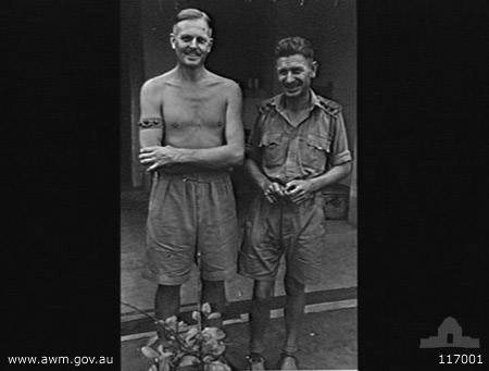 Singapore, 10/9/1945
Australian War Memorial caption reads:
SINGAPORE, STRAITS SETTLEMENTS. 1945-09-10. CAPTAIN (CAPT) F. T. JOHNSTONE, 2/18TH INFANTRY BATTALION (1); AND CAPT A. M. LAMACRAFT, 2/30TH INFANTRY BATTALION (2), 8TH AUSTRALIAN DIVISION EX-POWS OF THE JAPANESE, OUTSIDE THE OFFICER'S QUARTERS AT THE CHANGI GAOL.

Left to right:
1) NX12511 - JOHNSTONE, Frederick Thomas, Captain - 2/18 Battalion
2) NX34738 - LAMACRAFT, Alfred Howard Maudslay, Capt. - O/C C Company. E.D.

Keywords: 100105c