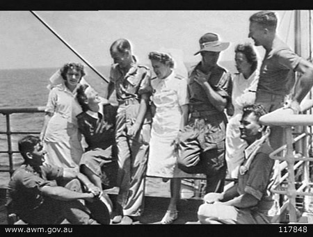 On board MV Highland Brigade, 11/10/1945
Australian War Memorial caption reads:
AT SEA. 1945-10-11. 8TH DIVISION EX-POWS OF THE JAPANESE WITH BRITISH ARMY NURSING SISTERS OF THE QUEEN ALEXANDRA IMPERIAL NURSING SERVICE, ON THE DECK OF THE BRITISH TROOPSHIP MV HIGHLAND BRIGADE DURING THEIR JOURNEY HOME TO AUSTRALIA. SHOWN: PRIVATE (PTE) A. SMITH, 2/4TH MACHINE GUN BATTALION (1); SISTER B. PADGEN (2); SISTER M. WARD (3); SERGEANT A. HAMILTON, 2/4TH MACHINE GUN BATTALION (4); SISTER K. B. HERD (5); PTE W. E. LYNN, 2/4TH MACHINE GUN BATTALION (6); SISTER J. MONTEITH (7); CORPORAL S. BRUCE, 2/30TH INFANTRY BATTALION (8); SERGEANT E. BAILEY, 4TH MOTOR TRANSPORT PLATOON (9).

1) PRIVATE (PTE) A. SMITH, 2/4TH MACHINE GUN BATTALION
2) SISTER B. PADGEN
3) SISTER M. WARD
4) SERGEANT A. HAMILTON, 2/4TH MACHINE GUN BATTALION
5) SISTER K. B. HERD
6) PTE W. E. LYNN, 2/4TH MACHINE GUN BATTALION
7) SISTER J. MONTEITH
8) NX37577 - BRUCE, John (Stanley) (Stan), Cpl. - BHQ. Postal Unit attached (standing against railing)
9) SERGEANT E. BAILEY, 4TH MOTOR TRANSPORT PLATOON (9).
Keywords: 100105c