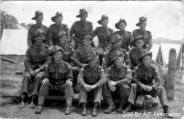 Mortar Platoon in training
This photo may have been taken at Tamworth, as the Battalion was accomodated in tents at Tamworth Showground.

Left to right:

Back row:
1) NX27259 - BLADWELL, Frederick Joseph (Fred), Sgt. - HQ Company, Mortar Platoon
2)
3) NX15405 - McALISTER, Albert James (Abby), A/U/WO2 - HQ Company, A/CSM.
4) NX46561 - COOK, Max, Pte. - HQ Company, Mortar Platoon
5) NX58157 - GREENWOOD, Frederick John (Jack), Pte. - HQ Company, Mortar Platoon
6) NX57292 - OWEN, Campbell Dunlop (Blue), Pte. - HQ Company, Mortar Platoon

Middle row:
1) NX26295 - DAWSON, Leonard Percy (Gobble Gobble), WO2 - HQ Company, CSM
2) NX54467 - STONE, Eric William, Cpl. - HQ Company, Mortar Platoon
3) NX70447 - KRECKLER, John Francis (Bib), Lt. - HQ Company, 2 I/c Mortar Platoon
4) NX31365 - McHUGH, Michael John (Mick), Pte. - HQ Company, Mortar Platoon
5) NX58187 - BARNS, Victor (Vic), L/Sgt. - HQ Company, Mortar Platoon

Front row:
1) NX24089 - HARRIS, John Evan (Scotty/Cock), Cpl. - HQ Company, Mortar Platoon
2) NX54474 - STEVENS, Francis Rupert Brotherson (Snowy), Pte. - HQ Company, Mortar Platoon
3) NX32306 - MACIVER, Donald Gunn (Bluey), Cpl. - HQ Company, Mortar Platoon
4) NX46503 - TATE, David William (Dave), A/U/Sgt. - HQ Company, Mortar Platoon
Keywords: Mortar