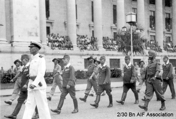 Japanese surrender, Singapore, 1945 (Photo 19)
Japanese General Itagaki and other senior Japanese officers being escorted to the Singapore Municipal Buildings for the signing of the surrender terms.
Keywords: Surrender