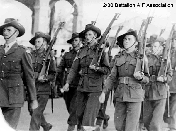 A Company, 7 Platoon
"A" Company march through Bathurst in 1941.

Left to right:
1) NX70458 - MASTON, Ronald Harry (Bomb Happy), Capt. - C Coy. 2 l/c
2) NX29973 - HALL, Rex Turnbull Sinclair (Sammy), A/L/Sgt. - A Coy. 7 Pl. 
3) NX41357 - CAMERON, Alan Rentoul, Lt. - C Coy. O/C 15 Pl. to Malaya OCTU 15/9/1941, Lt 12/12/1941
4) NX34417 - ROSS, Ernest Stanley, Cpl. - A Coy. 7 Pl. WiA Gemas
5) NX51313 - MADDEN, James Ross Harrington (Ross), Pte. - A Coy. 8 Pl.
6) NX27118 - COLLINS, Henry Edward (Harry), Cpl. - A Coy. 7 Pl. 
