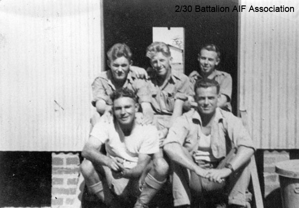 Bathurst Army Camp
On the steps of the A Company hut at Bathurst, 1941.

Left to right:
Back row:
1) NX31041 - BUTLER, Bernard Charles (Barney), Pte. - A Company,  9 Platoon, transferred to 8 Training Bn. on 22/5/1941
2) NX27550 - WILSON, David Royce (Doc), A/Cpl. - A Company,  9 Platoon 
3) NX20492 - HART, Sidney Kirkwood (Sid), Pte. - A Company,  9 Platoon, WiA Gemas

Front row:
1) NX25485 - GAGE, Frederick Clifton (Fred), Pte. - A Company,  9 Platoon, discharged 7/7/1941
2) NX33886 - CROFT, George Alexander, A/U/Sgt. - A Company,  9 Platoon, WiA Tyersall Palace, to AAOC Changi; Bn. Bootmaker
