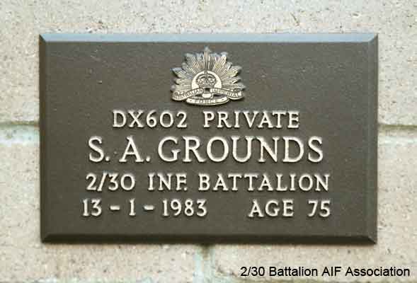 DX602 - GROUNDS, Sidney Aloysius (Sid), Pte. - A Company, 7 Platoon
View of the bronze plaque erected in the NSW Garden of Remembrance on Wall 9, Row F. The garden is adjacent to Sydney War Cemetery at the Rookwood Necropolis, and is maintained by The Office of Australian War Graves.

The plaques are provided by The Office of Australian War Graves to commemorate eligible veterans who have died post war and whose deaths are accepted as being caused by war service. This form of commemoration is used when there is a private memorial elesewhere, or for some reason, the Office is unable to provide an official memorial at the relevant Cemetery or Crematorium.
