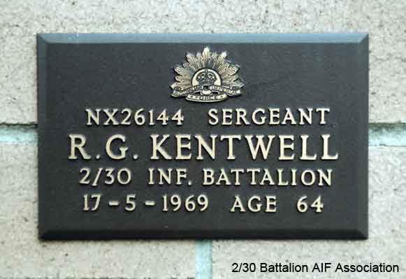 NX26144 - KENTWELL, Donald Geoffrey, Pte. - D Company, 18 Platoon
View of the bronze plaque erected in the NSW Garden of Remembrance on Wall 3, Row H. The garden is adjacent to Sydney War Cemetery at the Rookwood Necropolis, and is maintained by The Office of Australian War Graves.

The plaques are provided by The Office of Australian War Graves to commemorate eligible veterans who have died post war and whose deaths are accepted as being caused by war service. This form of commemoration is used when there is a private memorial elesewhere, or for some reason, the Office is unable to provide an official memorial at the relevant Cemetery or Crematorium.
