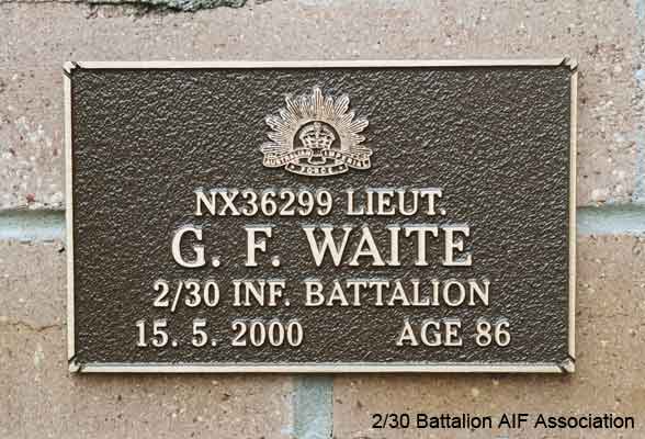 NX36299 - WAITE, Geoffrey Freeman, Lt. - C Company, O/C 13 Platoon
View of the bronze plaque erected in the NSW Garden of Remembrance on Wall 16, Row E. The garden is adjacent to Sydney War Cemetery at the Rookwood Necropolis, and is maintained by The Office of Australian War Graves.

The plaques are provided by The Office of Australian War Graves to commemorate eligible veterans who have died post war and whose deaths are accepted as being caused by war service. This form of commemoration is used when there is a private memorial elesewhere, or for some reason, the Office is unable to provide an official memorial at the relevant Cemetery or Crematorium.
