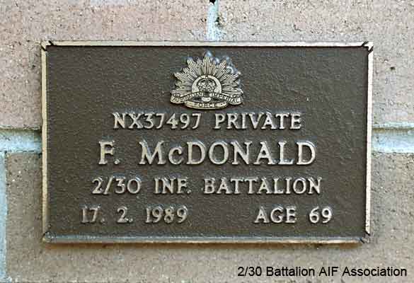 NX37497 - McDONALD, Frank (Blue), Pte. - B Company, 12 Platoon
View of the bronze plaque erected in the NSW Garden of Remembrance on Wall 57, Row A. The garden is adjacent to Sydney War Cemetery at the Rookwood Necropolis, and is maintained by The Office of Australian War Graves.

The plaques are provided by The Office of Australian War Graves to commemorate eligible veterans who have died post war and whose deaths are accepted as being caused by war service. This form of commemoration is used when there is a private memorial elesewhere, or for some reason, the Office is unable to provide an official memorial at the relevant Cemetery or Crematorium.
