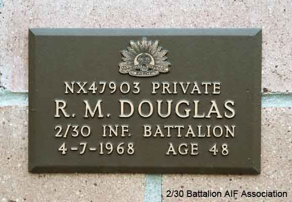 NX47903 - DOUGLAS, Roy Millwood (Chum), Pte. - B Company, 11 Platoon
View of the bronze plaque erected in the NSW Garden of Remembrance on Wall 2, Row L. The garden is adjacent to Sydney War Cemetery at the Rookwood Necropolis, and is maintained by The Office of Australian War Graves.

The plaques are provided by The Office of Australian War Graves to commemorate eligible veterans who have died post war and whose deaths are accepted as being caused by war service. This form of commemoration is used when there is a private memorial elesewhere, or for some reason, the Office is unable to provide an official memorial at the relevant Cemetery or Crematorium.
