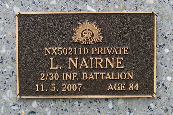 NX30116 - NAIRNE, Lawrence, Pte. - B Company (also served as NX502110)
View of the bronze plaque erected in the ACT Garden of Remembrance on Wall 22, Row D, Column 2. The garden is within Woden Cemetery in Canberra, and is maintained by The Office of Australian War Graves.

The plaques are provided by The Office of Australian War Graves to commemorate eligible veterans who have died post war and whose deaths are accepted as being caused by war service. This form of commemoration is used when there is a private memorial elsewhere, or for some reason, the Office is unable to provide an official memorial at the relevant Cemetery or Crematorium.
Keywords: 071031a