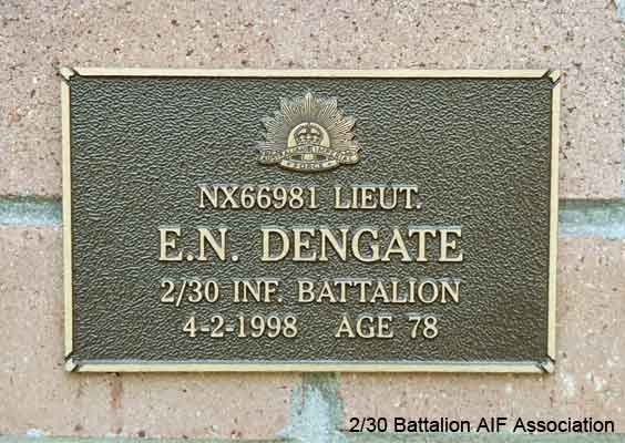 NX66981 - DENGATE, Edgar Norman, Lt. - B Company, O/C 12 Platoon
View of the bronze plaque erected in the NSW Garden of Remembrance on Wall 32, Row E. The garden is adjacent to Sydney War Cemetery at the Rookwood Necropolis, and is maintained by The Office of Australian War Graves.

The plaques are provided by The Office of Australian War Graves to commemorate eligible veterans who have died post war and whose deaths are accepted as being caused by war service. This form of commemoration is used when there is a private memorial elesewhere, or for some reason, the Office is unable to provide an official memorial at the relevant Cemetery or Crematorium.
