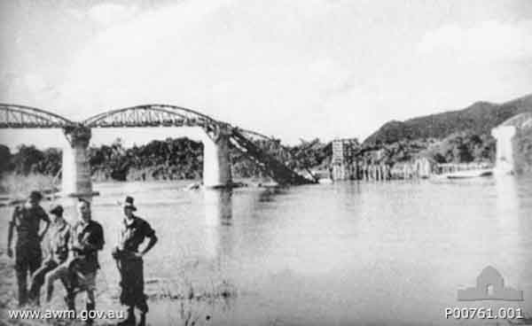 Bridge over the Mae Klong River
Tamarkan, Thailand. c. September 1945. The steel bridge over the Mae Klong River (renamed Kwai Yai River in 1960) This bridge, dismantled and brought from Java in 1942, was rebuilt by the Japanese using prisoner of war (POW) labour. It was finished and operational by May 1943. Allied air raids finally dropped one of the eleven spans in mid-February 1945. Two more spans were dropped during raids between April and June 1945. Tamarkan is fifty five kilometres north of Nong Pladuk (also known as Non Pladuk) and five kilometres north of Kanchanaburi. (Donor A. Mackinnon)
