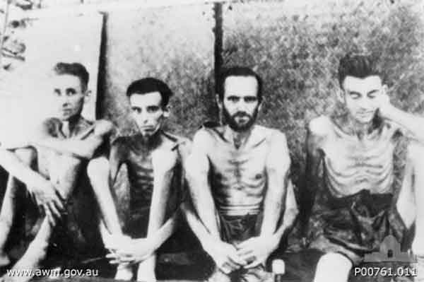 POWs with beri beri
Tarsau, Far East; Burma Thailand Railway.
Four prisoners of war (POWs) with beri beri. Identified is Jan Hakkaart (left) a radio operator from the Dutch Navy (RNN) who was captured in Java. Tarsau, now known as Nam Tok, is 130 kilometres from Nong Pladuk (also known as Non Pladuk), or 284 kilometres south of Thanbyuzayat. It was used by the Japanese as both a staging camp for POWs moving north to work on railway construction, and a base hospital during the period from November 1942 to April 1944. During this period 15,029 sick passed through it, of whom 806 died.
Credit line: 	Donor A Mackinnon
