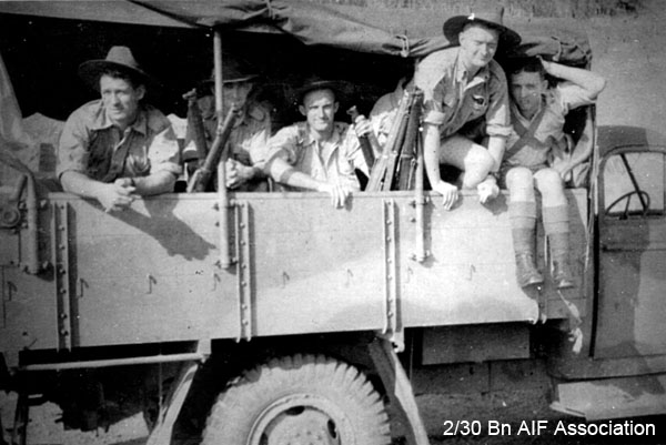 On the move in Malaya, 1941
Shifting camp in Malaya.

Left to right: 
1) NX5658 - WEBSTER, James Wilson, A/Cpl. - B Company HQ
2) NX25845 - BUCKINGHAM, Arthur George, A/U/Cpl. - B Company, 10 Platoon
3) NX20550 - McLEOD, Thomas Kennedy, A/Cpl. - B Company, 10 Platoon
4) NX52778 - NOSSITER, Reginald, Pte.  - B Company, 10 Platoon
5) NX47951 - NAGLE, Athol Gervase, L/Sgt. - B Ord. Room
Keywords: Malaya