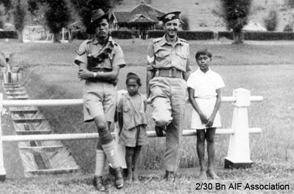 On leave in Malaya, 1941
Athol changed headgear with a member of the Sultan's Army.
Left to right: 1) unknown, 2) unknown, 3)  NX47951 - NAGLE, Athol Gervase, L/Sgt. - B Ord. Room, 4) unknown
Keywords: Malaya