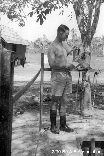 Training in Malaya, 1941
NX47951 - NAGLE, Athol Gervase, L/Sgt. - B Ord. Room with a tame monkey 
Keywords: Malaya
