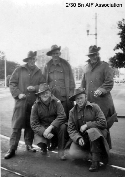 On leave in Perth, September 1941
"This is a snap of a group of us taken in Perth when we were coming over. Back: Charley Thomas, me, Sgt. King, Big Dingwell and Cliff Mudford in front"

Left to right:
Back row (standing):
1) NX2507 - THOMAS, Lemuel Charles Herbert (Charlie), Pte. - HQ Coy. Sig. Pl. - missing presumed dead, Singapore Island
2) NX30509 - SWADLING, Roy Leonard, Pte. - HQ Coy. Carrier Pl. - missing presumed dead, Singapore Island
3) NX30289 - KING, Graham Yabsley, L/Cpl. - D Company, 16 Platoon - died of illness Kanu 2 (Beri Beri, Dysentery) on 25/8/1943

Front row (kneeling):
1) NX41568 - DINGWELL, John Herbert Albert (Jack), Pte. - A Coy., 7 Pl.; C Coy. 13 and 15A Pl. 
2) NX20449 - MUDFORD, Clifton Hartley (Clif), Pte. - HQ Coy. Carrier Pl. - died of illness Kanburi (Cardiac Beri Beri) on 6/1/1944
Keywords: Sibajak