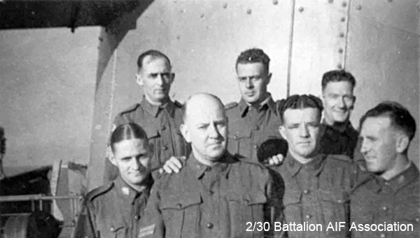 On the way to Singapore
On board Johan Van Oldenbarnevelt (HMT FF), part of Convoy US11B, between Sydney and Perth., still cold and F.S.D.

Left to right:

Front row:
1) NX32747 - GALBRAITH, Albert Thomas (Bert), A/U/S/Sgt. - HQ Coy. A/A Pl. Changi Concert Party Tailor
2) NX32830 - BROWN, Lewis Patrick (Lew), Sgt. - BHQ. Bn. Store. 
3) NX32560 - WRIGHT, Eric Stanley (Curly), Pte. - BHQ. Bn. Q. Store. 
4) NX29810 - HANNAN, Francis Patrick (Frank), Pte. - BHQ. Bn. Store. 

Back row:
1) NX57195 - GRATTAN, Sidney George (Sid), WO2 - BHQ. RQMS. 
2) NX52253 - MUFFETT, Donald (Don), Pte. - BHQ. Bn. Store. Doi Sonkurai 3 (Dysentery, Beri Beri)
3) NX26955 - FRANKS, Richard Lawrence (Dick), Pte. - BHQ. Bn. Store. Repatriated 31/12/1941
Keywords: Johan