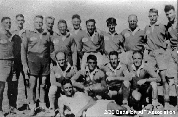 Rugby Union team at Bathurst
D Company Rugby Union team at Bathurst.

Left to right:
Back row:
1) NX47319 - GODBOLT, Raymond Cecil (Ray), Pte. - D Coy. 18 Pl. WiA Gemas
2) NX47570 - ROSS, William Maxwell (Max), Pte. - D Coy. 18 Pl.  (at rear)
3) NX47063 - MILLER, Clarence (Clarrie), Pte. - D Coy. 16 Pl. 
4) NX47489 - MOSES, Edward Stewart (Ted), Pte. - D Coy. 17 Pl. KiA Sempang Rengam (at rear)
5) NX47812 - BAIRD, James Harold (Jim), Pte. - D Coy. 17 Pl. Ex "A" Force; sent from Thailand to Japan after Railway completed; Rakuyo Maru torpedoed and sunk 12/9/1944 by US submarine
6) NX30289 - KING, Graham Yabsley, L/Cpl. - D Coy. 16 Pl. Doi Kanu 2 (Beri Beri, Dysentery) (at rear)
7) NX46136 - SPEERS, James Alexander (Jim), Pte. - D Coy. 16 Pl. to 2/1 Bn 6 Div
8) NX36657 - BEER, Noel Percival, Pte. - D Coy. 16 Pl. Doi Sandakan
9) NX47342 - NEWTON, William Henry Andrew (Bill), Pte. - D Coy. 18 Pl. 
10) NX47185 - OLDKNOW, Norman Dallas (Dal), Pte. - D Coy. 18 Pl. 
11) NX58216 - HARVEY, Charles, Pte. - D Coy. 16 Pl. Rose Force 23/12/41, Doi Kanburi (Cardiac Beri Beri, Dysentery, Malaria)

Front row:
1) NX42655 - GRAY, Andrew Ernest (Bluey), Pte. - C Coy. 15 Pl.  or
NX57786 - GRAY (Lawson), William Sydney (George W.), Pte. - D Coy. 17 Pl. 
2) NX47814 - THOMPSON, George Edward, Pte. - D Coy. 16 Pl. Doi Johore
3) NX47320 - GODBOLT, Harold, Pte. - D Coy. 18 Pl. Doi Lower Nieki (Cholera)
4) NX47145 - ROWNTREE, Stanley William (Snowy),Pte. - discharged 23/5/1941 

Lying down (Referee):
1) NX46183 - MATTHEWS, John William Simpson (Jack), Pte. - D Coy. 17 Pl. 
