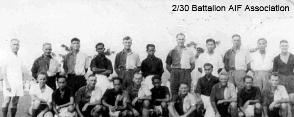 Batu Pahat and 2/30 Battalion Soccer Teams
The Batu Pahat and 2/30 Battalion soccer teams, which played against each other on the padang at Batu Pahat in late 1941.

The Battalion soccer team normally wore white shirts, but as the Batu Pahat team also played in white, the Battalion chose to wear the 2 tone "A" Company jerseys.

The game finished in a 2 all draw. Batu Pahat's 2 goals were scored by their inside left, who was a Malayan International. Jack Salisbury scored the Bn's first goal and George Stephenson scored the equaliser.

Left to right:
Back row:
1) ? (Referee)
2) NX25780 - GODLEY, David (Scotty), Pte. - HQ Coy. Carrier Pl. WiA Sempang Rengam, Doi Sonkurai 3 (Dysentery)
3) NX24089 - HARRIS, John Evan (Scotty/Cock), Cpl. - HQ Coy. Mortar Pl. 
4) ?
5) NX54467 - STONE, Eric William, Cpl. - HQ Coy. Mortar Pl. (Captain)
6) ?
7) NX36453 - MABEN, Roland Robert (Roly), Pte. - HQ Coy. Mortar Pl. WiA Sempang Rengam, Doi Sandakan
8) ?
9) NX45174 - LONIE, John Graham (Jack), Pte. - HQ Coy. Sig. Pl. 
10) ?
11) NX27159 - WHITE, George Harold (Doughy), Cpl. - BHQ. Cook HQ Coy.  (goalie in black shirt)

Front row:

1) NX26865 - POPE, John Sidney Malcolm (Jack), Pte. - C Coy. 15 Pl. (Linesman)
2) ?
3) NX36564 - STEPHENSON, George, Pte. - HQ Coy. A/A Pl. WiA Mandai Rd.
4) ?
5) NX20550 - McLEOD, Thomas Kennedy, A/Cpl. - B Coy. 10 Pl. - died after Rakuyo Maru torpedoed and sunk on 12/9/1944 by US submarine
6) ?
7) NX34411 - SOUTHWELL, Colin Leslie (Les), Pte. - A Coy. 7 Pl. WiA Causeway
8) ?
9) NX54474 - STEVENS, Francis Rupert Brotherson (Snowy), Pte. - HQ Coy. Mortar Pl. 
10) ?
11) NX53054 - SALISBURY, John Edward (Jack), L/Cpl. - A Coy. 7 Pl. 
