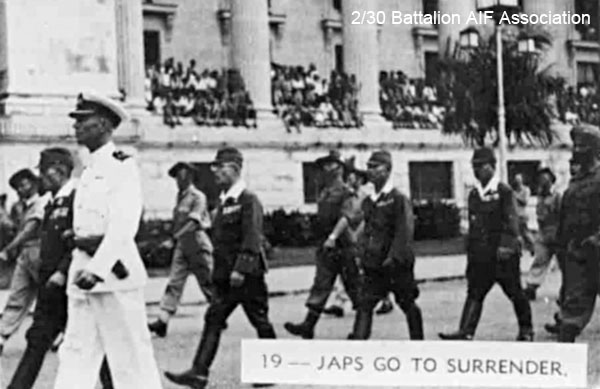 Japanese surrender, Singapore, 1945 (Photo 19)
Japanese General Itagaki and other senior Japanese officers being escorted to the Singapore Municipal Buildings for the signing of the surrender terms.
