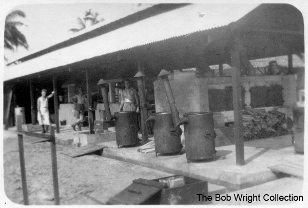 Cookhouse at Batu Pahat
"H.Q. Cookhouse. Nov. 1941."

1. The photographs are to be known as The Bob Wright Collection.
2. Reproduction of the Collection or any part of it is prohibited without written permission.
3. Permission is granted to the 2/30th Batallion Association to reproduce the Collection as it deems appropriate.
4. Permission is granted to the Australian War Memorial Museum to reproduce the Collection as it deems appropriate.
5. All other permission is specifically withheld.
6. Written application for permission to reproduce the Collection, or part of it, may be made to:
Mr I. Wright
95 Hewitt Avenue
Wahroonga 2076 New South Wales

