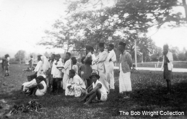 Football game at Batu Pahat
"Natives watching our boys playing football. Oct. 1941."

1. The photographs are to be known as The Bob Wright Collection.
2. Reproduction of the Collection or any part of it is prohibited without written permission.
3. Permission is granted to the 2/30th Batallion Association to reproduce the Collection as it deems appropriate.
4. Permission is granted to the Australian War Memorial Museum to reproduce the Collection as it deems appropriate.
5. All other permission is specifically withheld.
6. Written application for permission to reproduce the Collection, or part of it, may be made to:
Mr I. Wright
95 Hewitt Avenue
Wahroonga 2076 New South Wales

