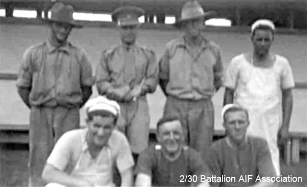 With the Cooks at Tamworth
Left to right:

Back row:
1) NX45260 - KEPPIE, Halgon Leslie James, Pte. - discharged 4/4/1941
2) NX12548 - PRYDE, John Alan (Gula), Capt. - BHQ Coy. QM. Pl. Involved in accident at Bathurst during Bren gun carrier training exercise, May 1941
3) NX33559 - HELLMRICH, Thomas Frederick, Lt. - A Coy. 9 Pl. OTS. Bathurst. did not sail
4) NX66651 - DOUGLAS, Walter Lewis (Darkie), Pte. - BHQ. Cook D Coy. 

Front row:
1) NX32421 - GEOGHEGAN, Mervyn Ross (Joe), Pte. - BHQ. Cook.
2) ? - JOHNSON, ?
3) NX26771 - WILLMOTT, Arthur James (Jimmy), Pte. - A Coy. 7 Pl. Doi AGH Changi (Peritonitis, Dysentery)
