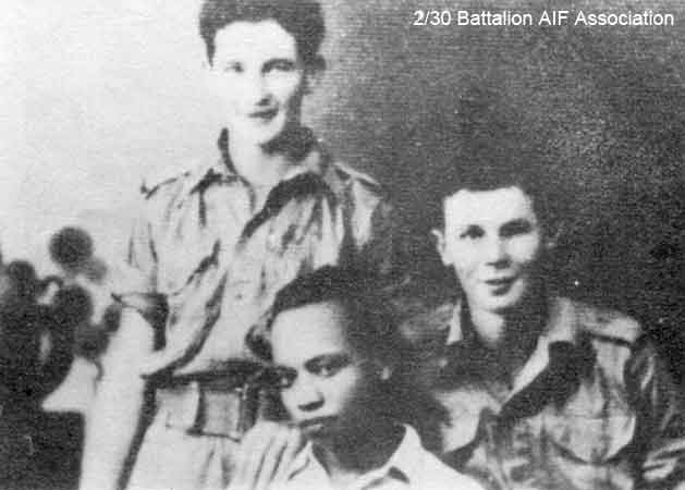 Batu Pahat
"Skeeter" Wilson and "Curly" Gill with a Malayan friend, Sid Garieb at Batu Pahat.

Left to right:
1) NX37312 - WILSON, John Whiteman (Skeeter), Pte. - C Company, 13 Platoon
2) ? - GARIEB, Sid, RAOF
3) NX37308 - GILL, Leslie Bede (Curlie), Pte. - C Company, 13 Platoon

