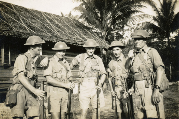 In camp in Malaya
In camp in Malaya.  Bill Skene is second from left.  The identity of the others is unknown.

Left to right:
1) ?
2) NX30114 - Pte. William Hartridge (Bill) SKENE - C Company, 14 Platoon
3) ?
4) ?
5) ?

Keywords: 20120722 NX30114