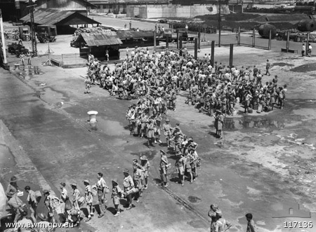 Waiting to board at Singapore
Singapore, 22/9/1945. Personnel of the 2/30th Australian Infantry Battalion, ex-Prisoners of War of the Japanese, embarking aboard the Australian vessel, the MV  Esperance Bay, for their journey home to Australia.
Keywords: 100105c