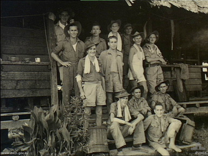 Kuching, Sarawak, 12/9/1945
Australian War Memorial caption reads:
Kuching, Sarawak. 1945-09-12. 8th Division personnel, ex-Prisoners-of-War of the Japanese, outside their hut "Australia House" in the Kuching POW and Internment Camp, which they occupied from 1943-06 to 1945-09. Identified personnel are: Sergeant C. B. Lander, 2/18th Infantry Battalion; Corporal G. W. Gunning, 2/2nd Pioneer Battalion; Private (Pte) H. J. P. Riseley, 2/29th Infantry Battalion; Pte R. Kent, 2/20th Infantry Battalion; Pte E. Davis, 2/20th Infantry Battalion; Driver R. Fraser, 2/3rd Motor Transport Company; Driver Stephenson, 2/3rd Motor Transport Reserve Company; Pte D. Rixon, 2/20th Infantry Battalion; Lance Corporal N. Weekes, Base Ordnance Depot; Pte J. Simpson, 2/18th Infantry Battalion; Pte F. Bindon, 2/18th Infantry Battalion, and Pte S. Outram, 2/30th Infantry Battalion.

1) SERGEANT C. B. LANDER, 2/18TH INFANTRY BATTALION
2) CORPORAL G. W. GUNNING, 2/2ND PIONEER BATTALION
3) PRIVATE (PTE) H. J. P. RISELEY, 2/29TH INFANTRY BATTALION
4) PTE R. KENT, 2/20TH INFANTRY BATTALION
5) PTE E. DAVIS, 2/20TH INFANTRY BATTALION
6) DRIVER (DR) R. FRASER, 2/3RD MOTOR TRANSPORT COMPANY
7) DR STEPHENSON, 2/3RD MOTOR TRANSPORT RESERVE COMPANY
8) PTE D. RIXON, 2/20TH INFANTRY BATTALION
9) LANCE CORPORAL N. WEEKS, BASE ORDNANCE DEPOT
10) PTE J. SIMPSON, 2/18TH INFANTRY BATTALION
11) PTE F. BINDON, 2/18TH INFANTRY BATTALION
12) NX37369 - OUTRAM, Sidney Murray, Pte. - A Company, 8 Platoon. WiA Fort Rose, prisoner in Outram Rd. Gaol
Keywords: 100105c