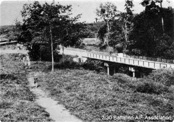 1979 Tour, Day 04
Gemencheh Bridge 14/1/1979 - Photographer on the Monday was standing in HQ of B Company at the ambush site, and looking towards Tampin. The new bridge is on the right. Old road leads to site of old bridge where old road takes off. On far bank is position where marquee was set up on the Sunday for the Commemoration Ceremony at Gemencheh Bridge.

Included in the report of the 2/30 Bn Group Tour to Malaysia and Singapore. See details in [url=http://www.230battalion.org.au/Makan/Issues/Makan248.htm#Day04]Makan 248, Day 4, 14/1/1979.[/url]
Keywords: Makan248