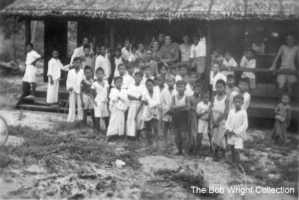 On arrival at Batu Pahat
"The native kids who welcomed us on our arrival at the new camp. 1941"

1. The photographs are to be known as The Bob Wright Collection.
2. Reproduction of the Collection or any part of it is prohibited without written permission.
3. Permission is granted to the 2/30th Batallion Association to reproduce the Collection as it deems appropriate.
4. Permission is granted to the Australian War Memorial Museum to reproduce the Collection as it deems appropriate.
5. All other permission is specifically withheld.
6. Written application for permission to reproduce the Collection, or part of it, may be made to:
Mr I. Wright
95 Hewitt Avenue
Wahroonga 2076 New South Wales

